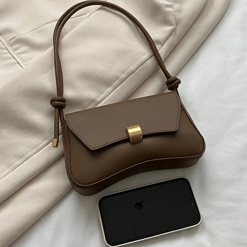 Schultertasche mit Klappverschluss und verstellbarem Riemen